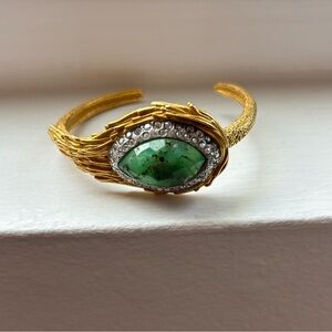 Alexis Bittar gold bangle with crystals and green stone